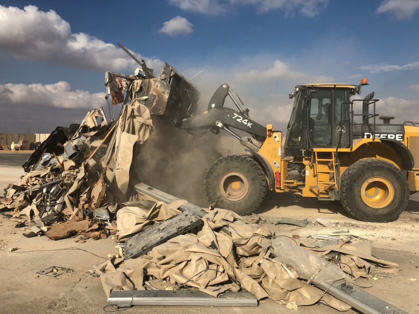 A bulldozer is used to clear rubble and debris at Asad Air Base in western Iraq on Jan. 13. The damage was caused by an Iran missile attack on Jan. 8.