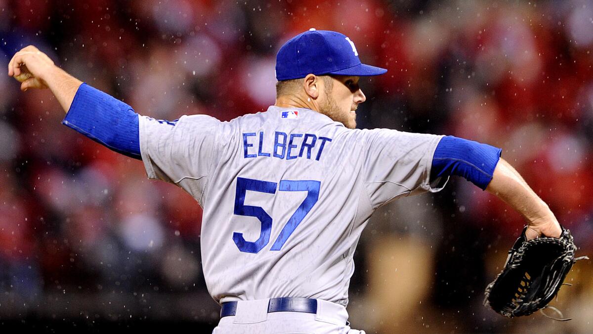 Dodgers reliever Scott Elbert delivers a pitch during the seventh inning of a 3-1 loss to the St. Louis Cardinals in Game 3 of the National League division series on Monday.