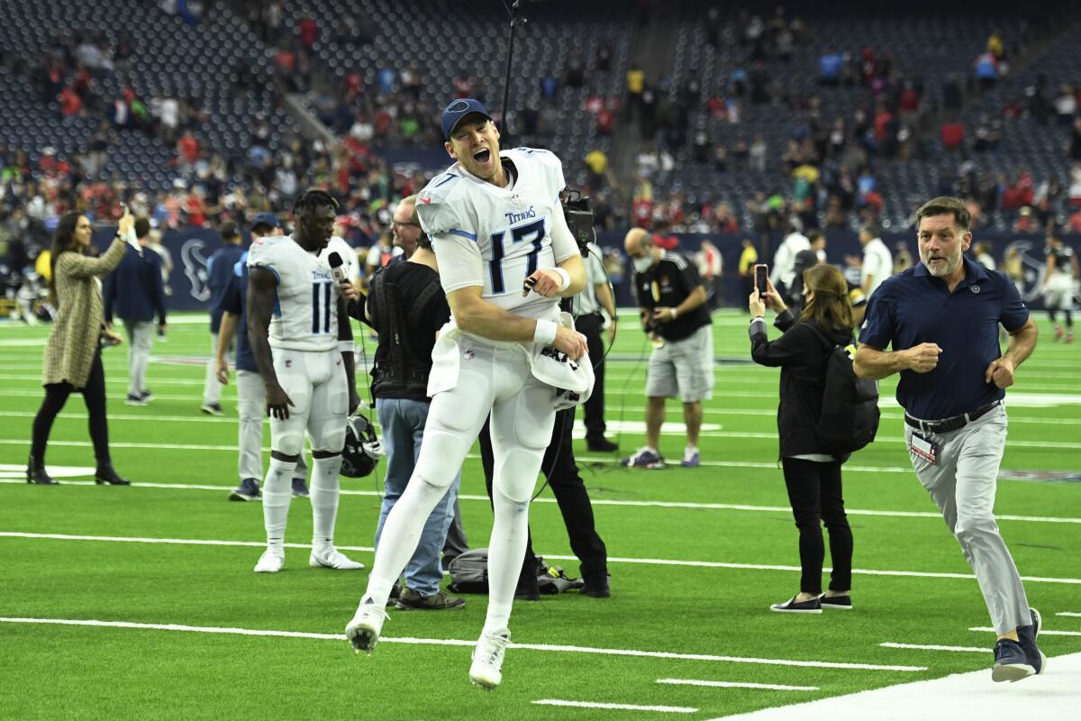 Tennessee Titans quarterback Ryan Tannehill (17) celebrates with fans after their win over the Houston Texans in an NFL football game, Sunday, Jan. 9, 2022, in Houston. (AP Photo/Justin Rex )