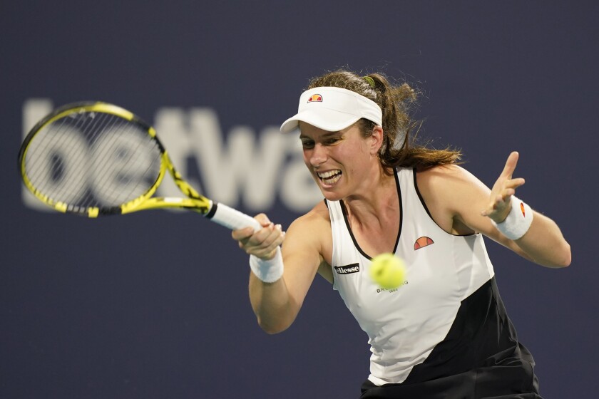 FILE - Johanna Konta of Britain, returns to Petra Kvitova of the Czech Republic, during the Miami Open tennis tournament in Miami Gardens, USA, on March 27, 2021. British tennis player Johanna Konta has announced her retirement. The 30-year-old Konta reached a high in the rankings of No. 4 and was a four-time title winner on the WTA. She became the first British woman to reach the Wimbledon semifinals in 39 years when she got to that stage in 2017. She was also a semifinalist at the Australian Open (2016) and French Open (2019). Konta made her announcement on social media. She said she was grateful to have been able “to live my dreams.” Konta told the WTA’s website she didn’t have the energy to put in the hard work to stay at the top of the sport." (AP Photo/Wilfredo Lee, File)
