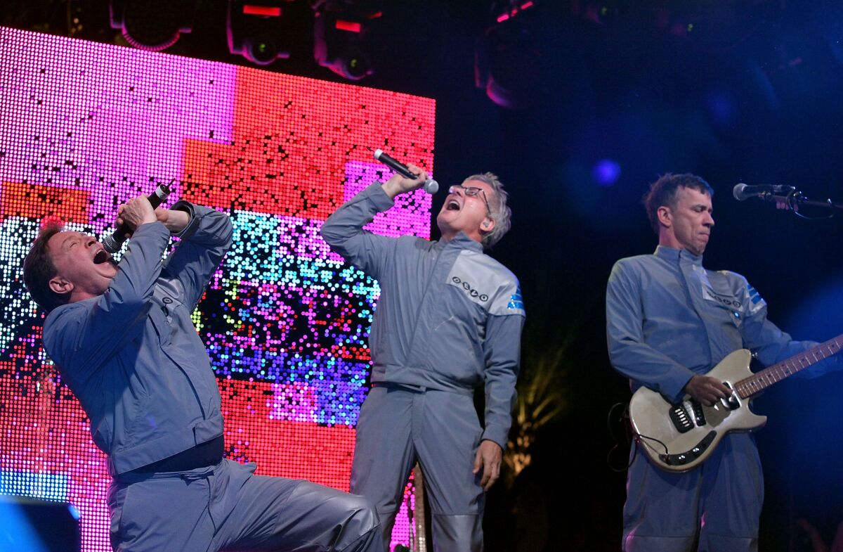 Mark Mothersbaugh (center) performing with the band at Coachella in 2010.