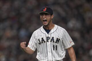 Japan's relief pitcher Yu Darvish reacts during the seventh inning of the quarterfinal game between Italy and Japan at the World Baseball Classic (WBC) at Tokyo Dome in Tokyo, Japan, Thursday, March 16, 2023. (AP Photo/Toru Hanai)