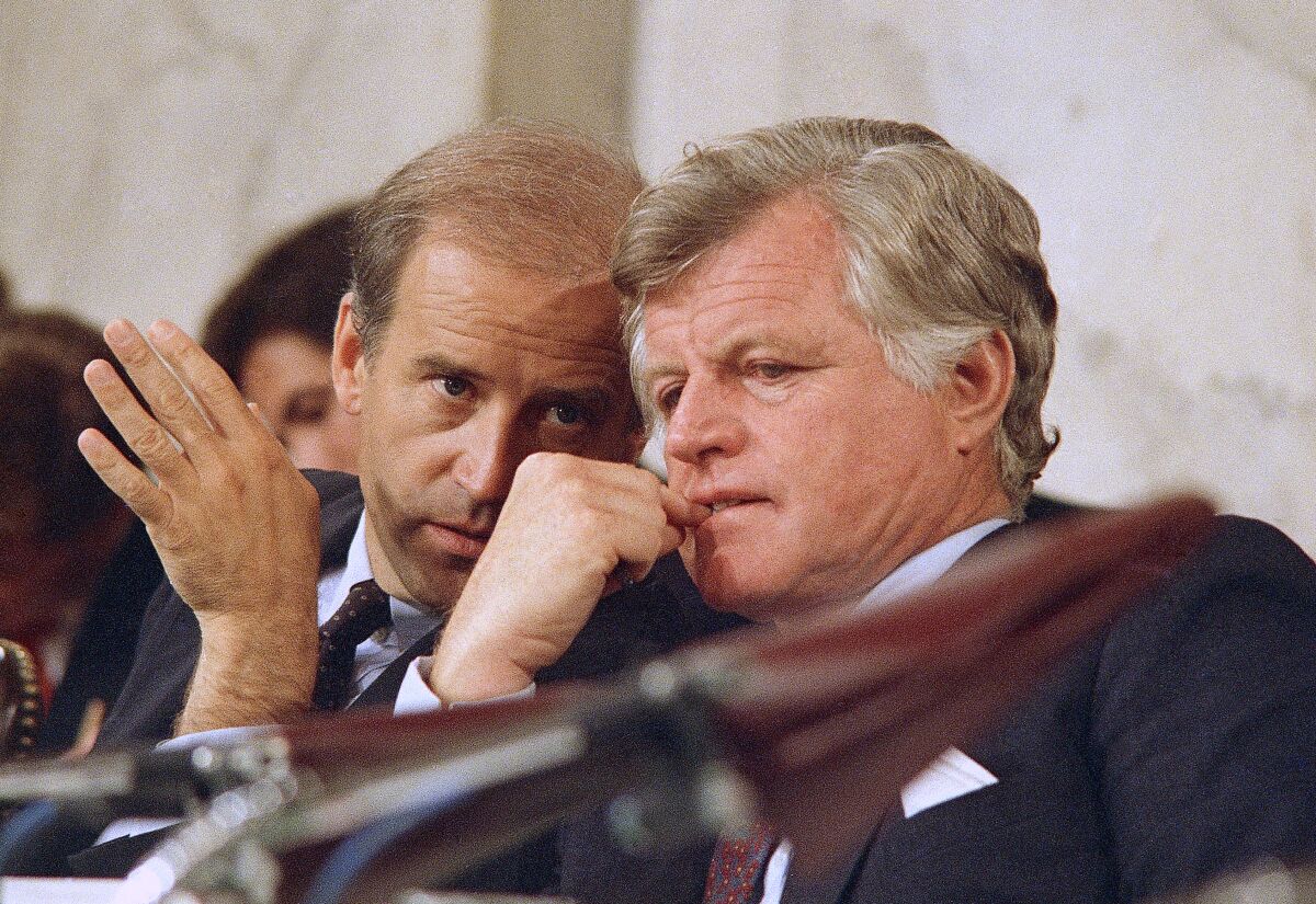 FILE - Senate Judiciary Chairman Joseph Biden Jr., of Delaware, left, speaks with Sen. Edward Kennedy, D-Mass., during the confirmations hearings for Supreme Court nominee Robert H. Bork on Capitol Hill in Washington, Sept. 16, 1987. During the hearing Biden focused his questioning on Griswold v. Connecticut, a 1965 decision that allowed married couples to buy birth control. “If we tried to make this a referendum on abortion rights, for example, we’d lose," he wrote in his 2007 memoir, “Promises to Keep.” (AP Photo/John Duricka, File)