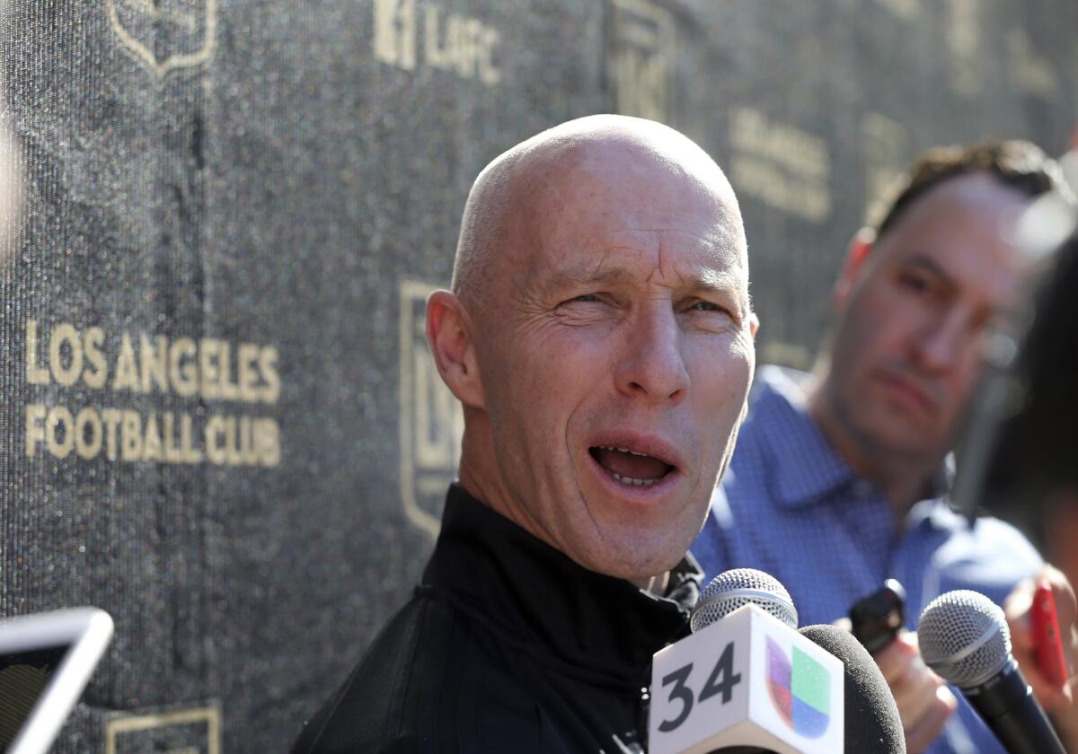 Head coach Bob Bradley talks with reporters during the introduction of players and coaches at the first training camp of the Los Angeles Football Club MLS soccer team on the campus of UCLA in Los Angeles, Monday, Jan. 22, 2018.