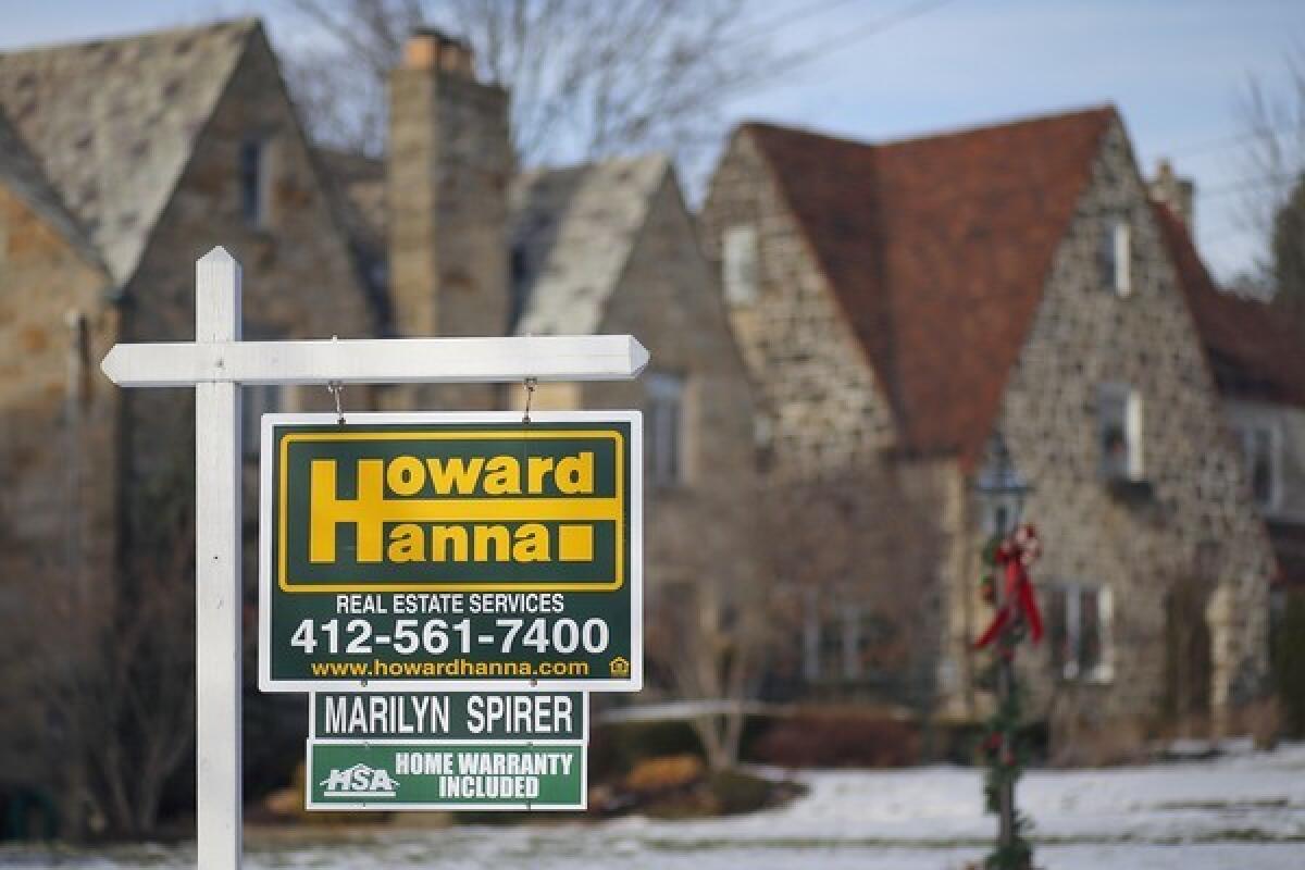 Existing-home sales in December rose 1% from the previous month to an annual rate of 4.87 million, the National Assn. of Realtors said Thursday. Above, a home for sale in Mount Lebanon, Pa.