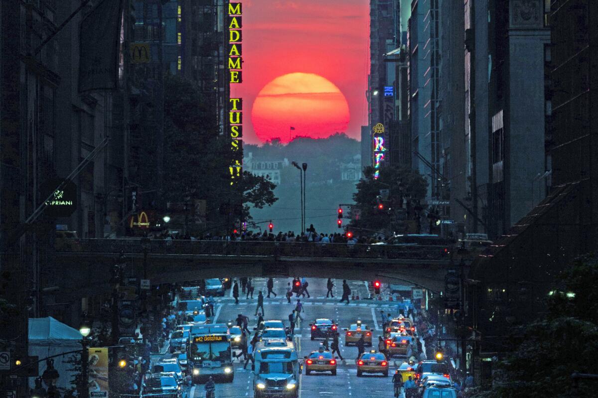 The sun sets along 42nd Street in Manhattan on May 29, 2013, during an annual phenomenon known as "Manhattanhenge," when the sun aligns perfectly with the city's transit grid.