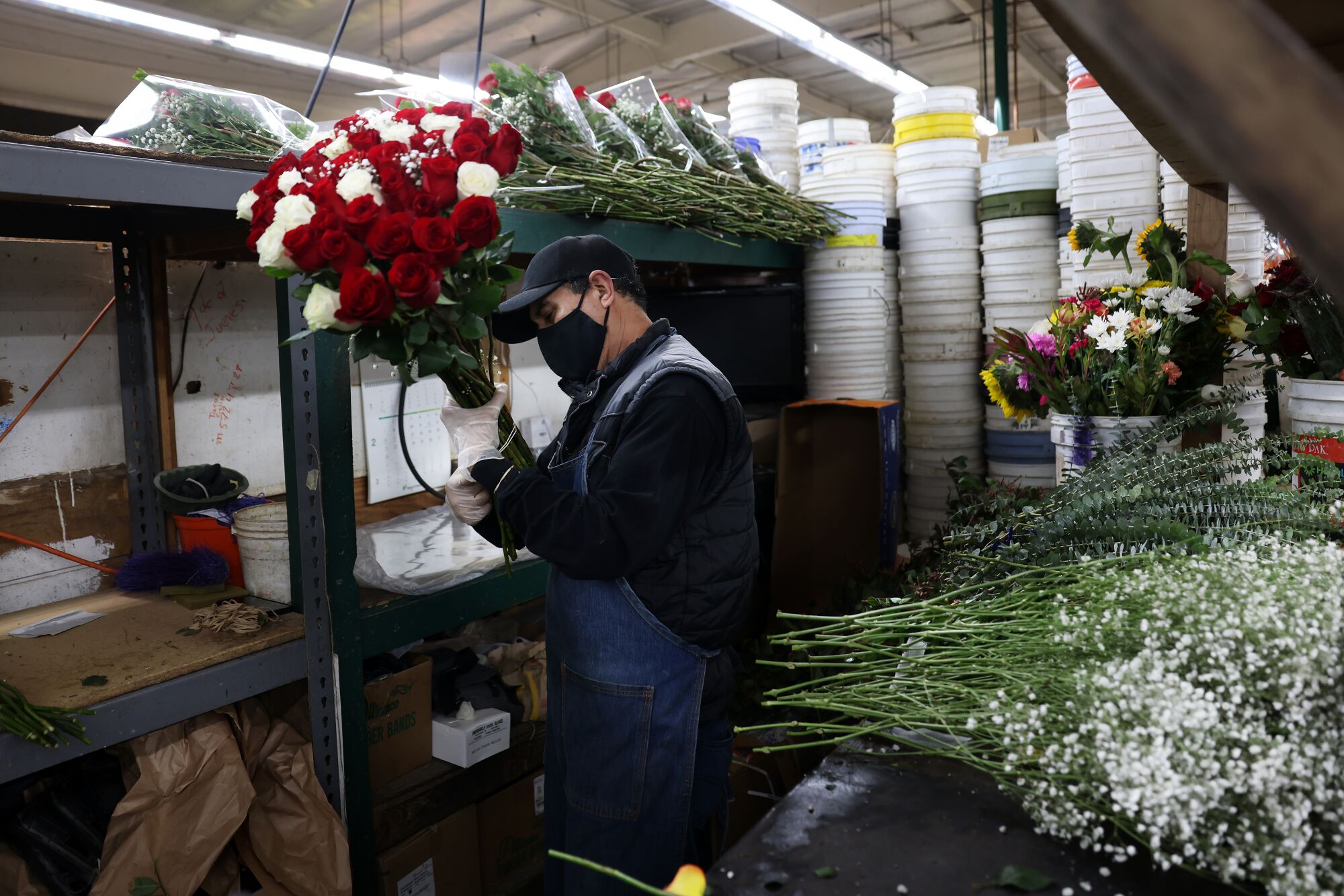 Alfredo Campos arranges bouquets at Julia's Wholesale Flowers.