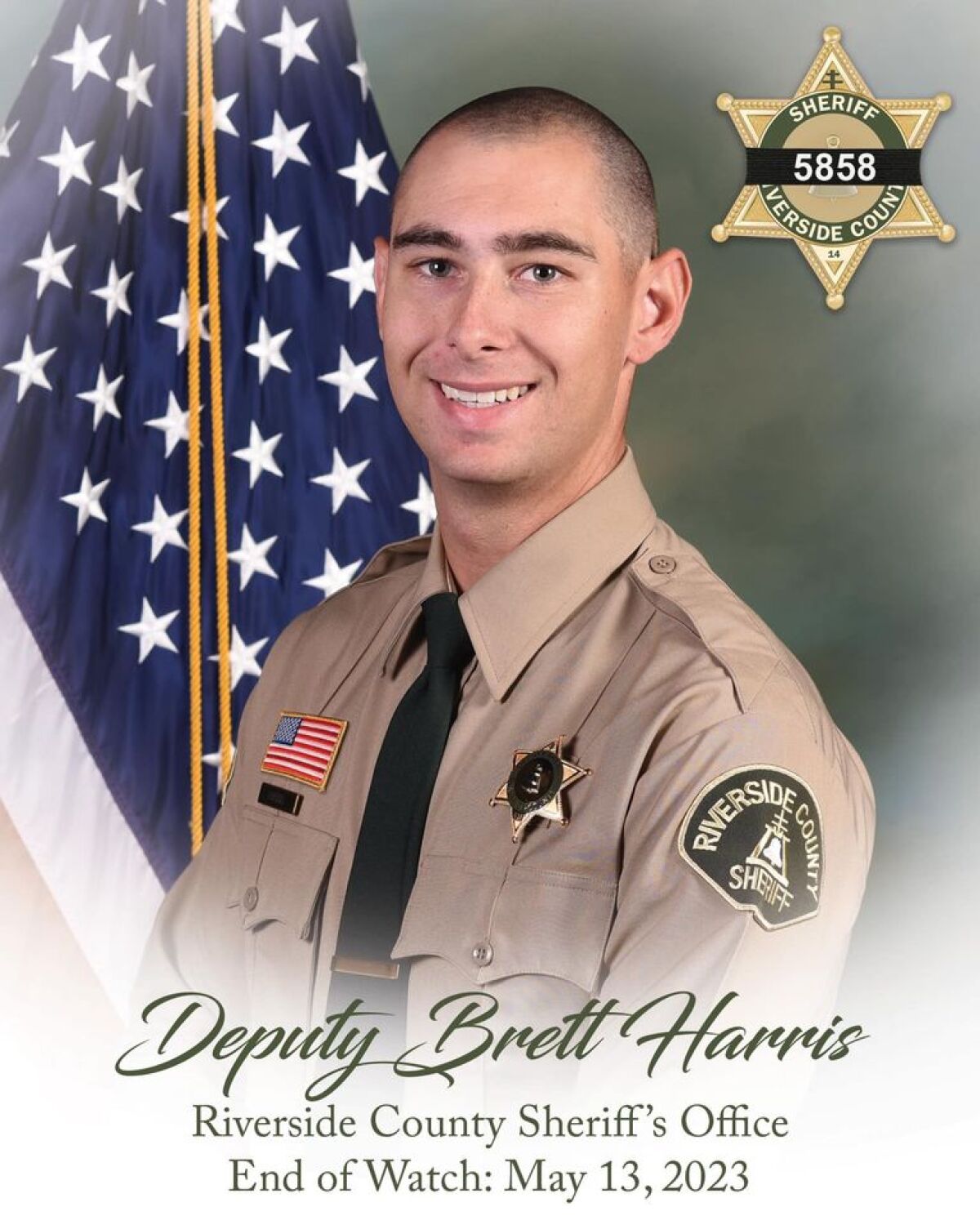 Riverside County Deputy Sheriff poses for a portrait in front of the US flag