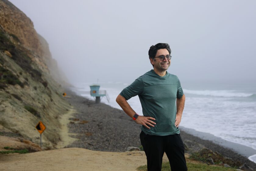 SAN DIEGO, CA - NOVEMBER 4: Ardem Patapoutian, the Scripps Research scientist who won this year's Nobel Prize in medicine, regularly walks 6 miles from his home in Del Mar to work, shown here at Torrey Pines State Beach on Thursday, Nov. 4, 2021., CA. (K.C. Alfred / The San Diego Union-Tribune)