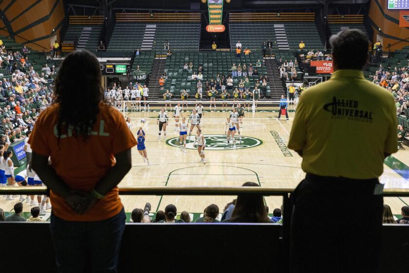 Workers monitor the NCAA Mountain West women's volleyball game between the Colorado State University Rams and San Jose State University Spartans at Moby Arena in Fort Collins, Colo., on Thursday, Oct. 3, 2024. (Santiago Mejia/San Francisco Chronicle via AP)