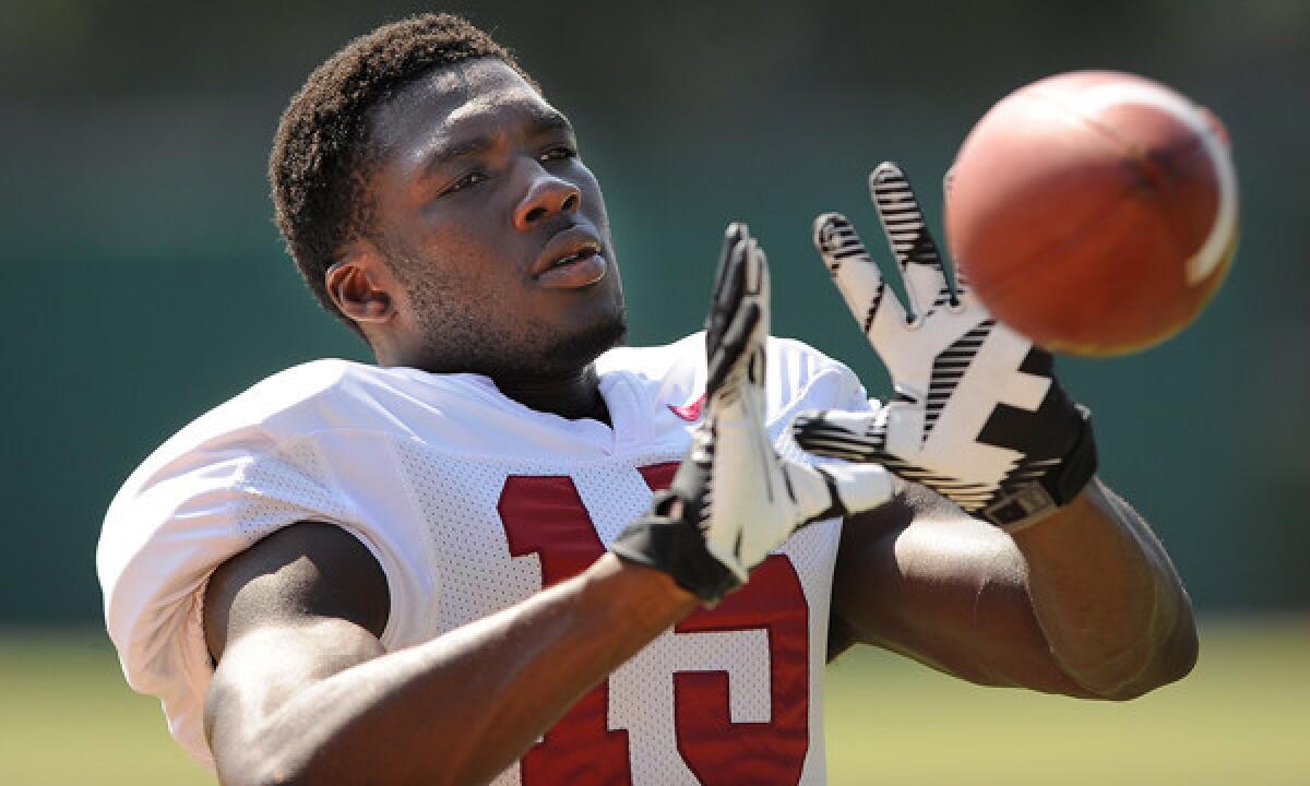 USC wide receiver Nelson Agholor warms up during a team practice session in August. Agholor showed off some of his skills Saturday during a team scrimmage at the Coliseum.