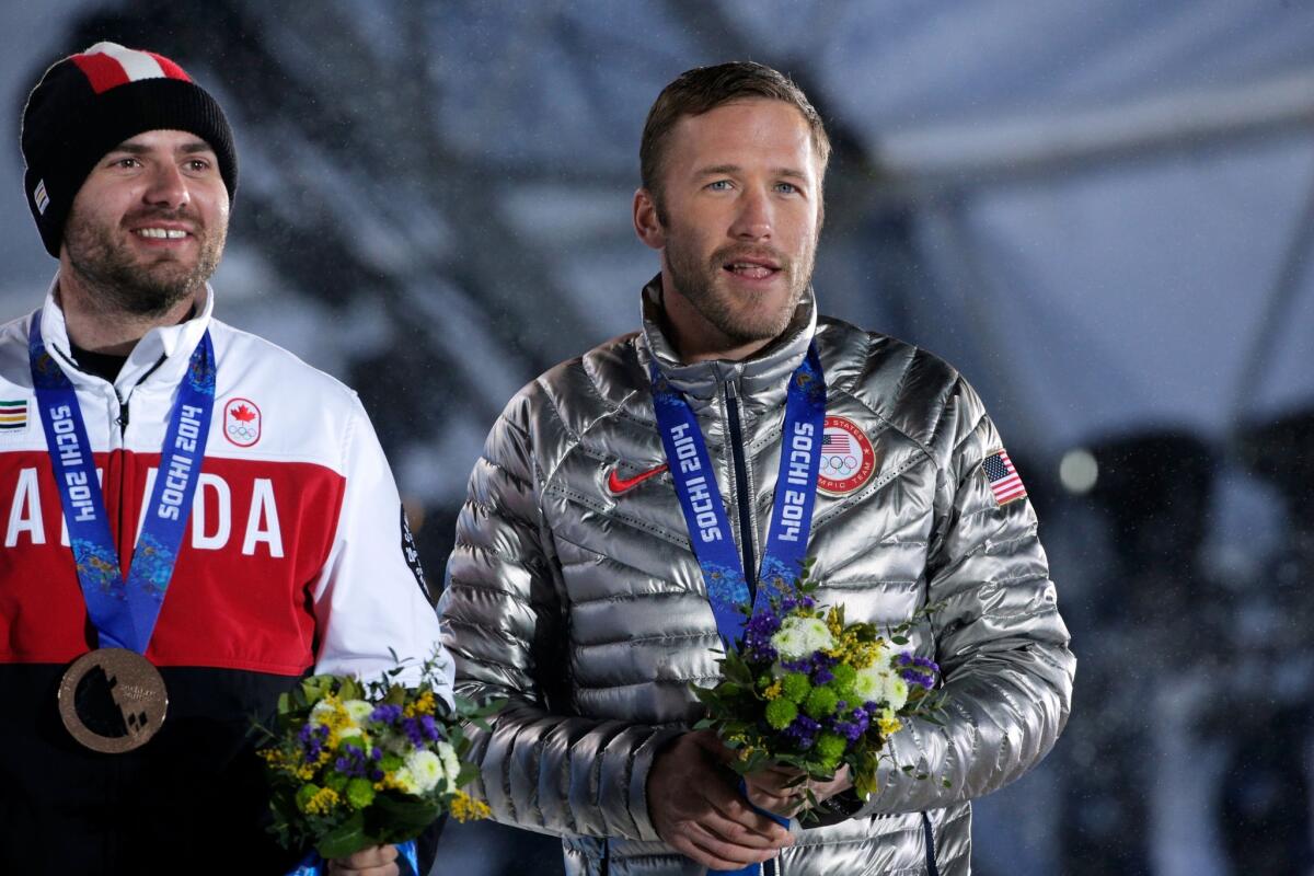 Joint bronze medalists for the men's super-G event Jan Hudec, left, and Bode Miller.