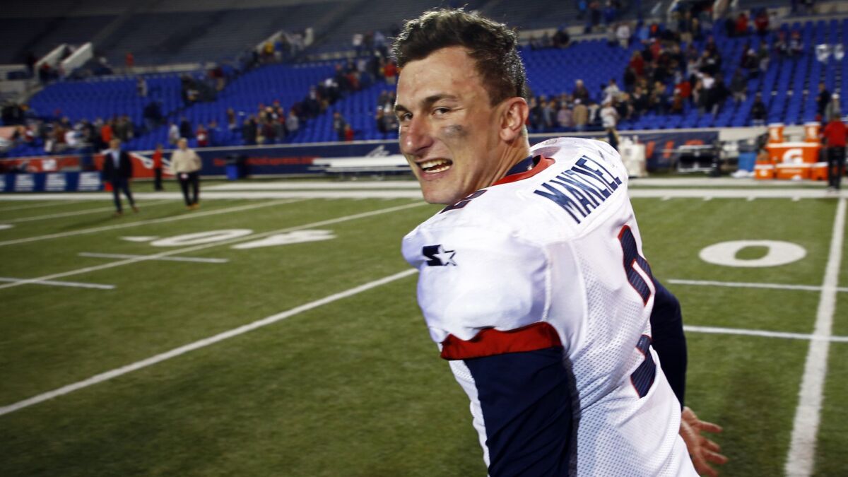 Memphis Express quarterback Johnny Manziel celebrates as he leaves the field after a March 24 win over the Birmingham Iron at Liberty Bowl Memorial Stadium.