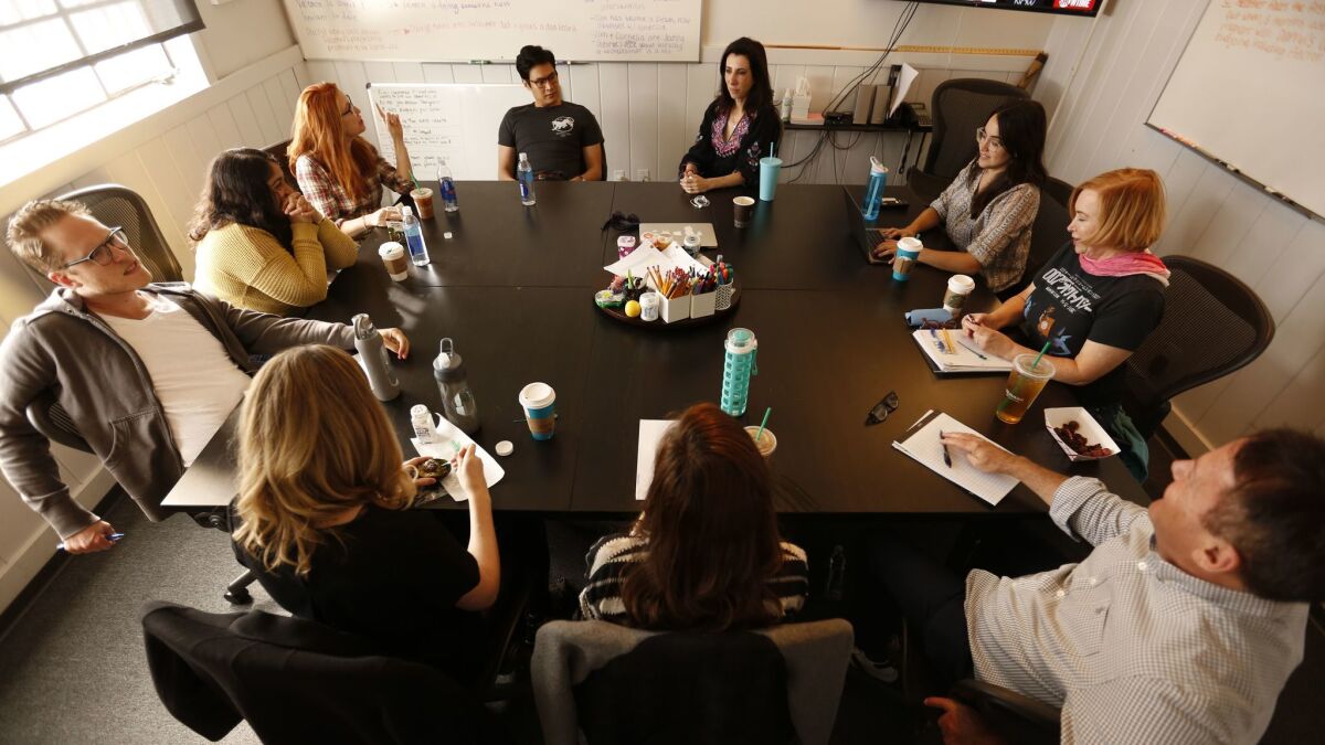 Aline Brosh-McKenna, center, co-creator and showrunner of the CW's "Crazy Ex-Girlfriend," directs a writing session on the third season on September 26, 2017.