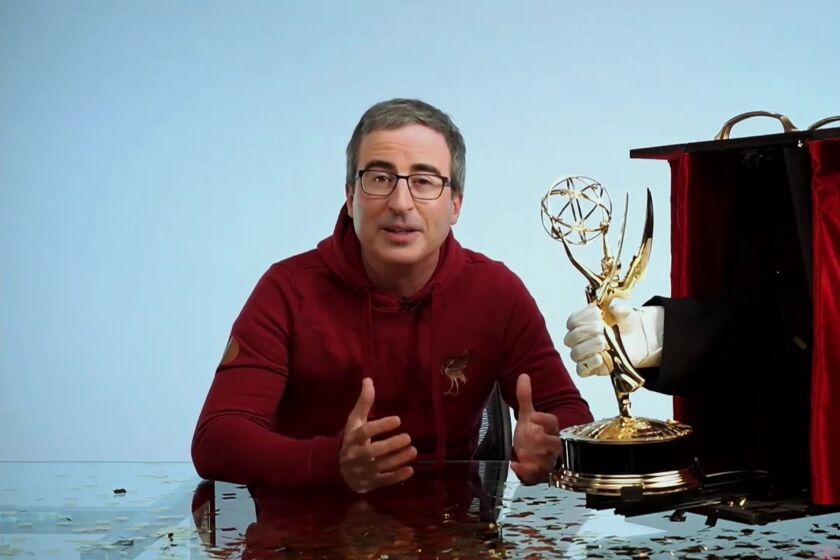 John Oliver with his Emmy