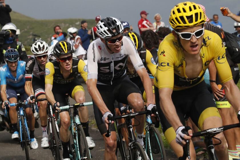Britain's Geraint Thomas, wearing the overall leader's yellow jersey, Britain's Chris Froome, second right, Netherlands' Steven Kruijswijk, third from left, Netherlands' Tom Dumoulin, second left, and Spain's Mikel Landa Meana, left, climb Col du Portet pass during the seventeenth stage of the Tour de France cycling race over 65 kilometers (40.4 miles) with start in Bagneres-de-Luchon and finish in Saint-Lary-Soulan, Col du Portet pass, France, Wednesday July 25, 2018. The Tour de France thinks it has some solutions to liven up the action with today's shorter mountain stage with three grueling climbs, including an uphill finish, intermediate bonus sprints, and a Formula One-like grid start. (AP Photo/Christophe Ena )