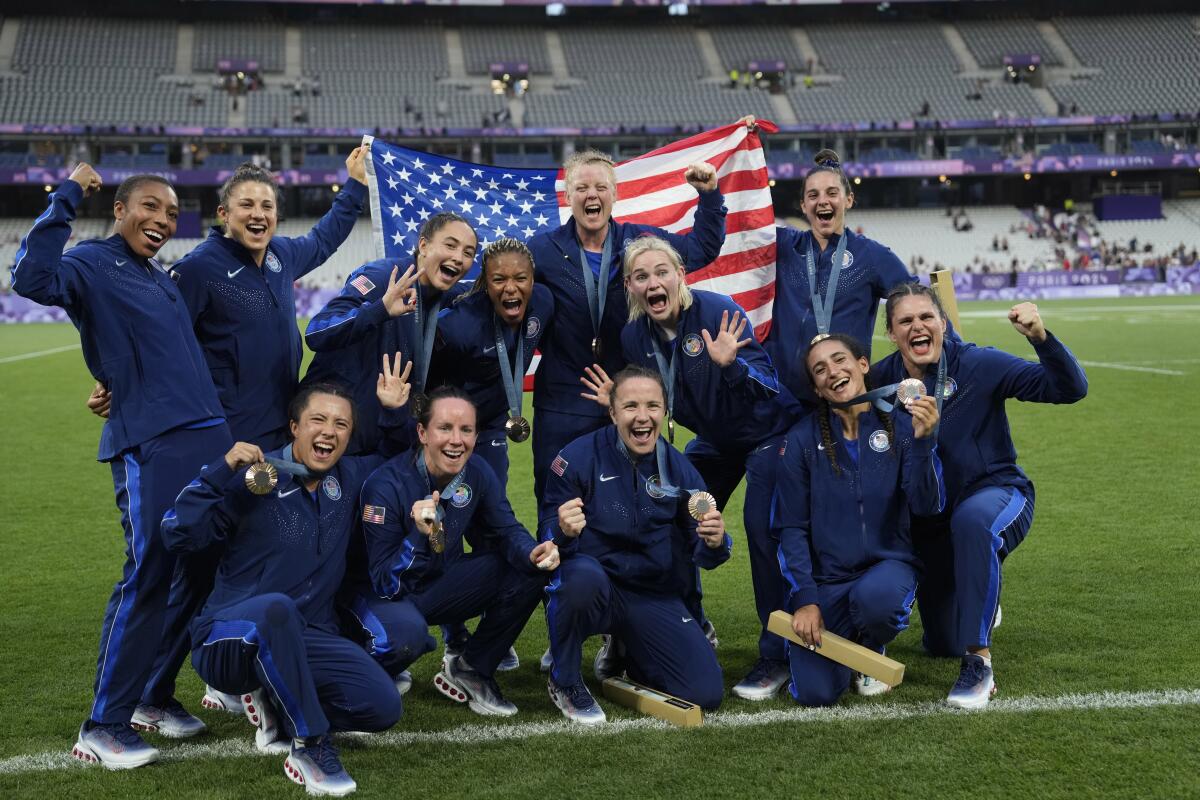 Members of the U.S. women’s rugby sevens pose with their bronze medals Tuesday at the 2024 Summer Olympics.