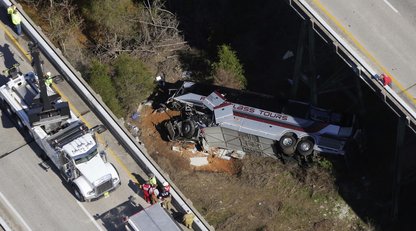 Rescue crews work at the scene of a deadly charter bus crash on March 13, 2018, in Loxley, Ala.