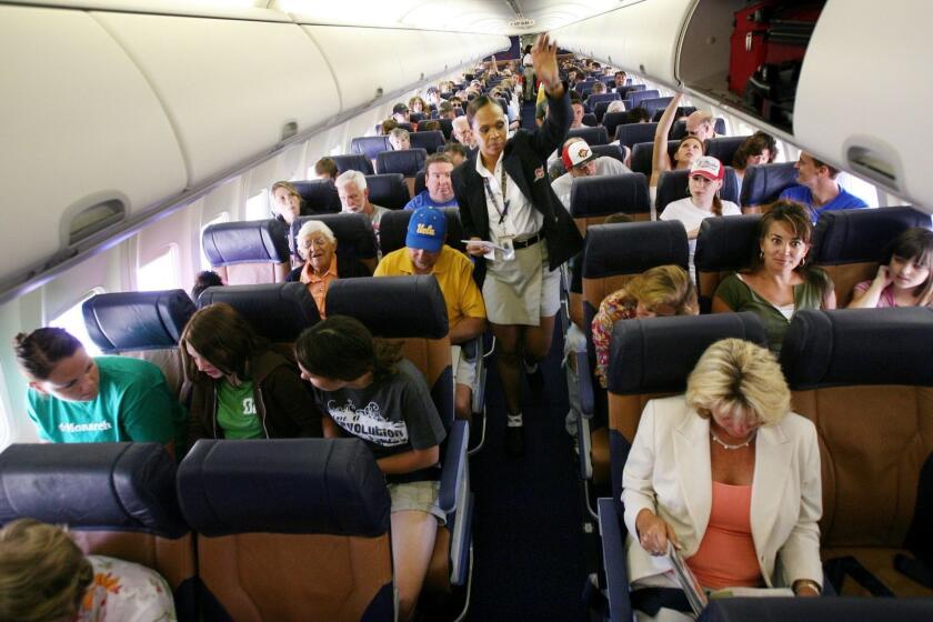 SAN DIEGO, CA - JULY 10: Passengers sit in their assigned seats before take-off July 10, 2006 at San Diego's Lindburgh Field Airport in San Diego, California. Contrary to the airlines's traditional practice, Southwest is experimenting with a new passenger seating system which made a trial run from San Diego to Phoenix. (Photo by Sandy Huffaker/Getty Images)