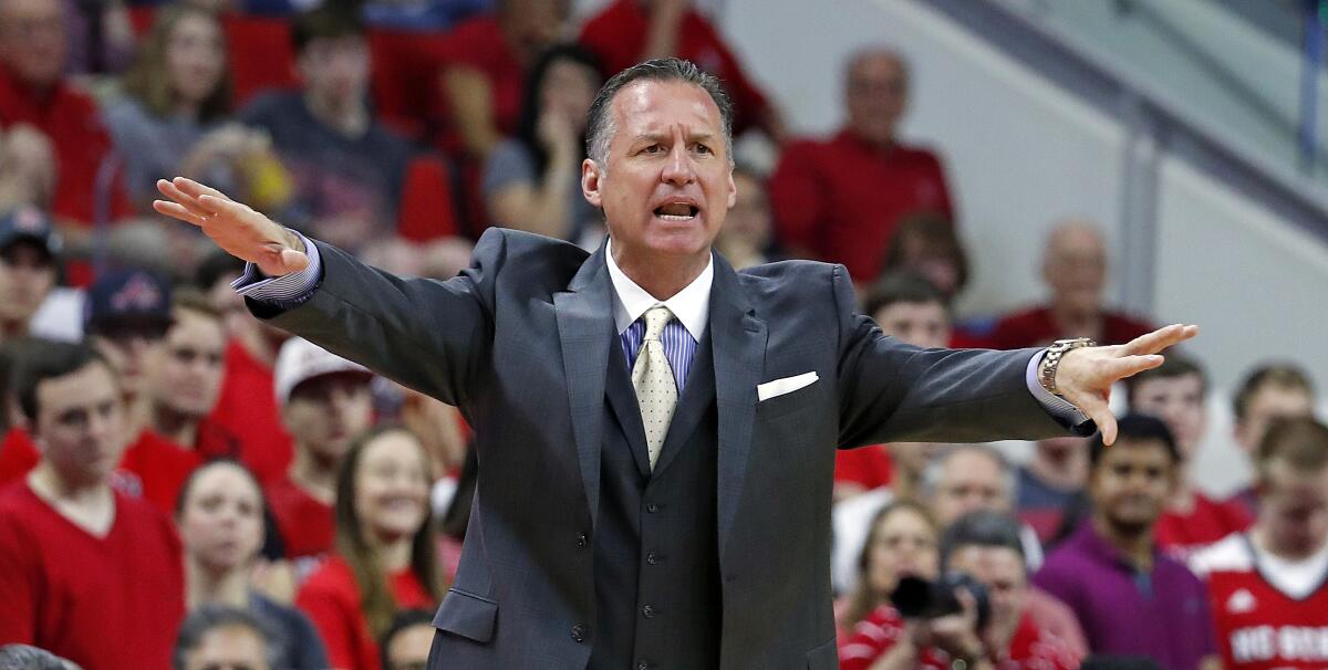 Mark Gottfried coaches during a game for North Carolina State.