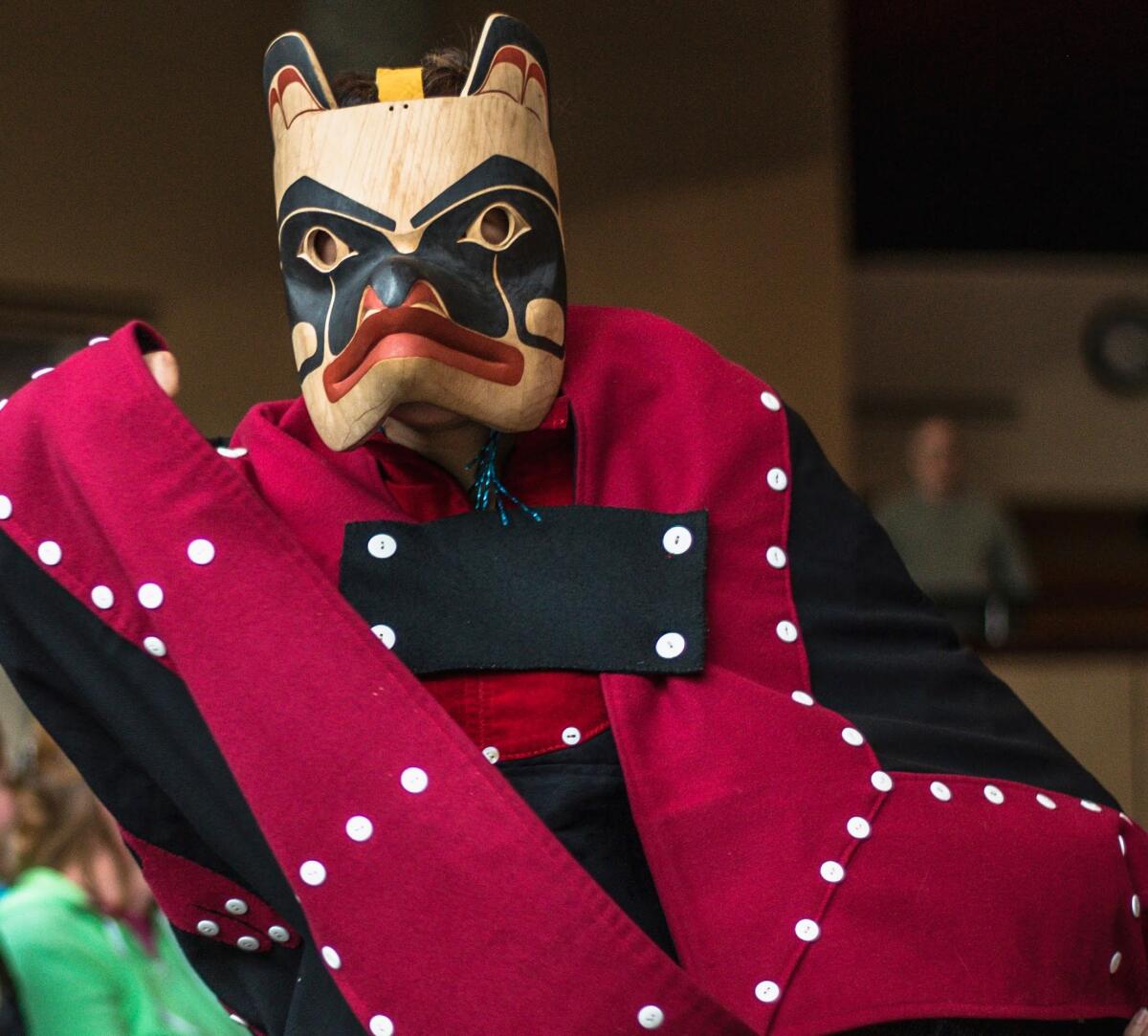 A Native Alaskan performs a traditional dance during a ceremony at the Alaska Native Heritage Center in Anchorage. While shut down, the center is providing live storytelling online. 

