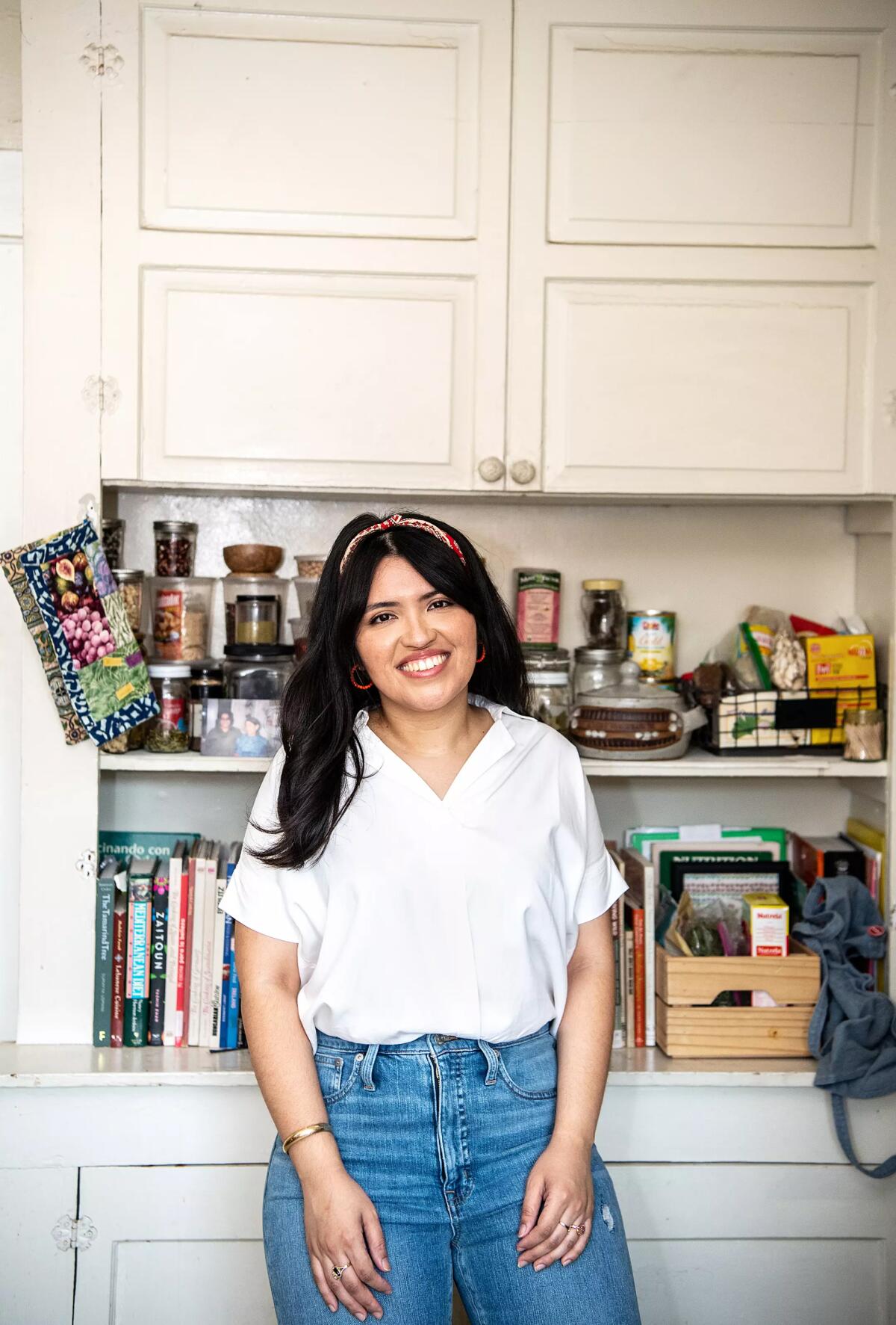 Karla Tatiana Vasquez inside her kitchen in 2020, as she worked to to get “The SalviSoul Cookbook” published.