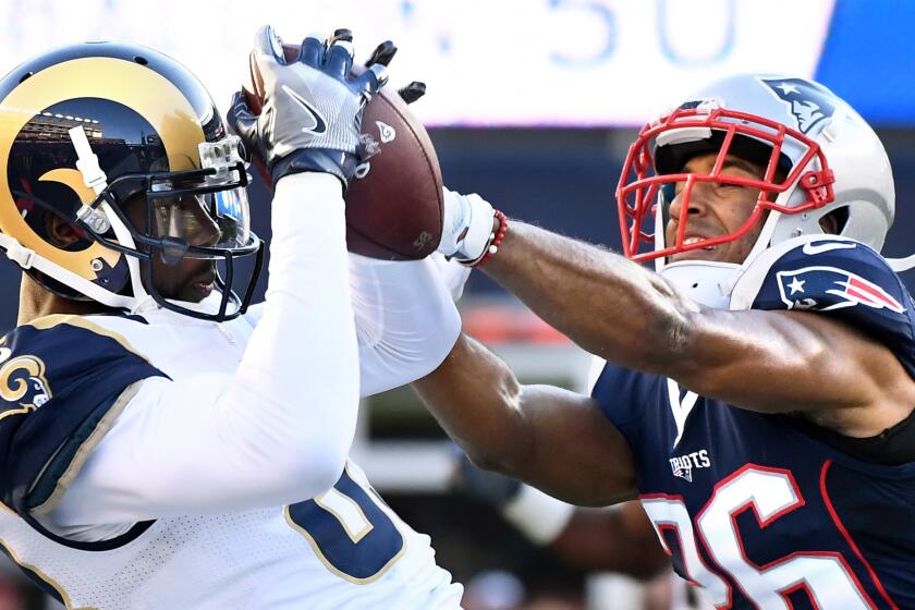 Rams receiver Brian Quick mkaes a catch in front of Patriots cornerback Logan Ryan during the third quarter.