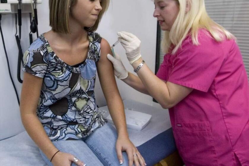 Lauren Fant receives her final dose of the HPV vaccine in Marietta, Ga. A new study from the CDC shows that the vaccine reduces rates of HPV infection.