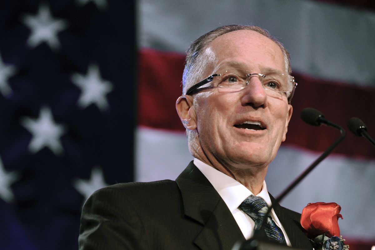 Mike Emrick speaks after being inducted into the U.S. Hockey Hall of Fame in 2011.