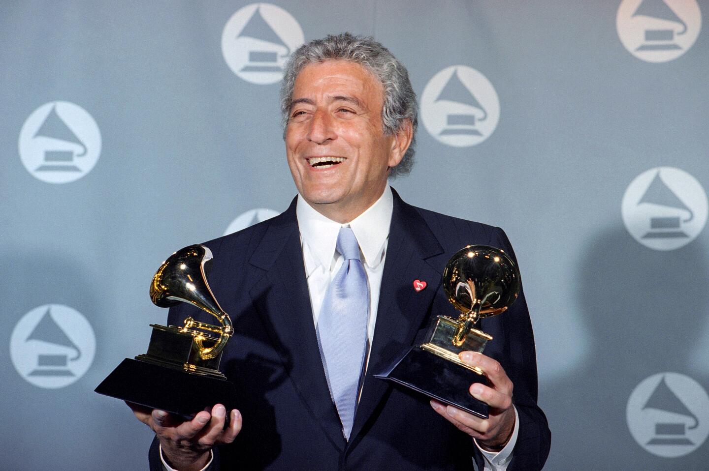 Tony Bennett displays his two Grammy's backstage at the Shrine Auditorium in Los Angeles