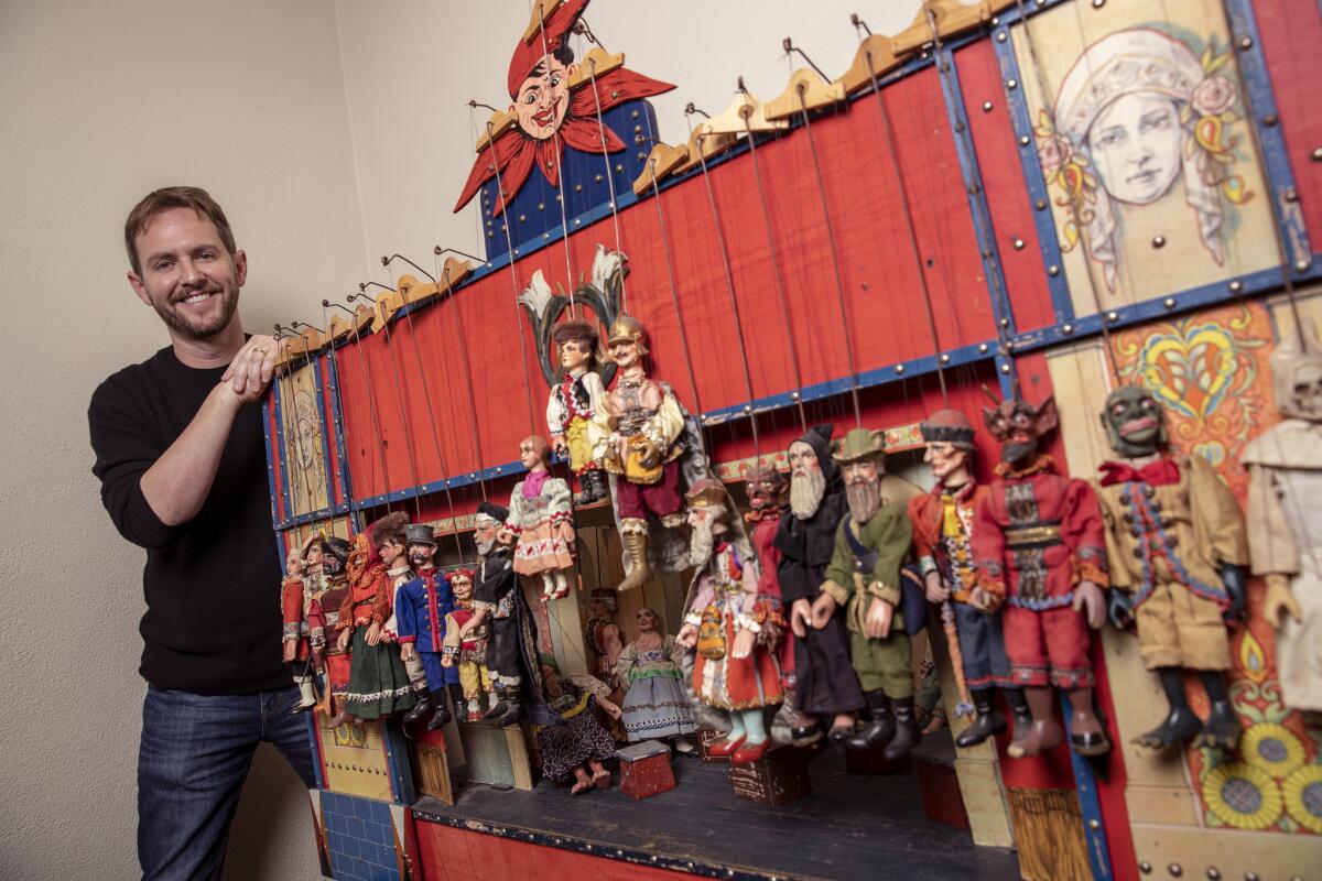 Matt Shakman and his vintage puppet theater in his office at the Geffen Playhouse.