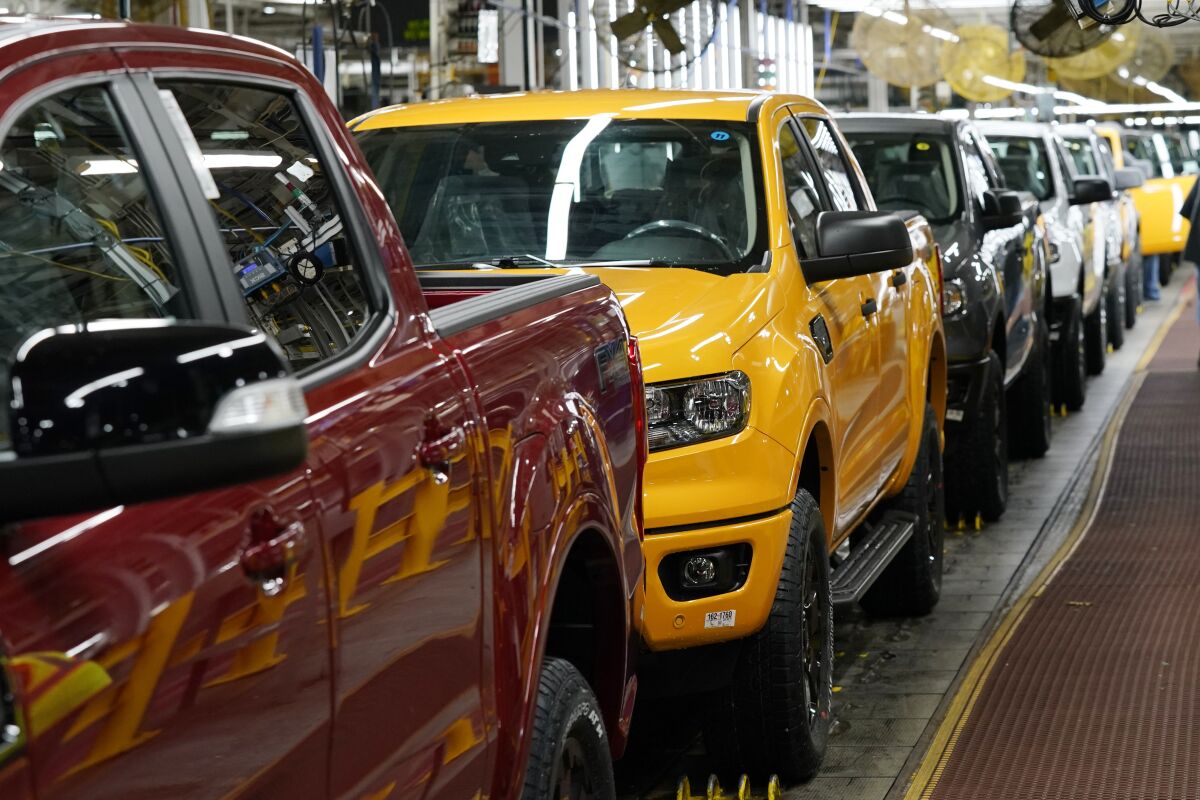FILE - Model year 2021 Ford Ranger trucks on the assembly line at Michigan Assembly, Monday, June 14, 2021, in Wayne, Mich. U.S. industrial production increased 0.5% in November 2021 as output at the nation's factories reached the highest level since January 2019.(AP Photo/Carlos Osorio)