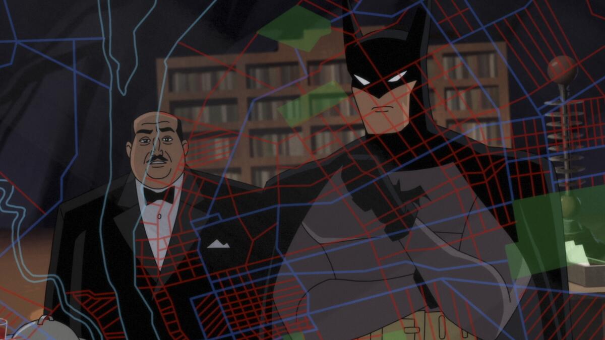 Alfred and Batman look at a grid of Gotham City.