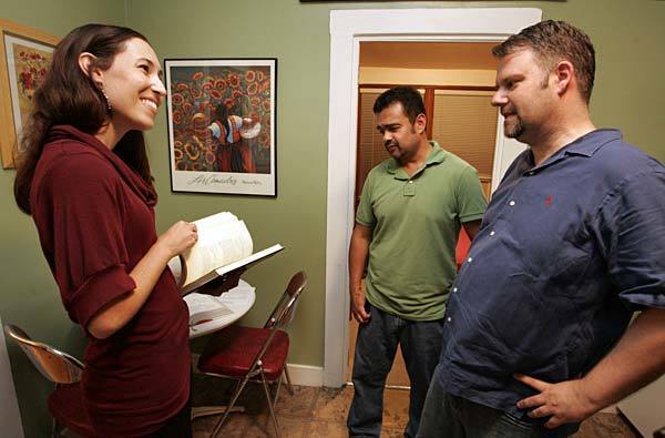 USC nutrition expert Emily Ventura consults with Duncan MacLeod, right, and Rafael Navarro about how they can improve their diets.
