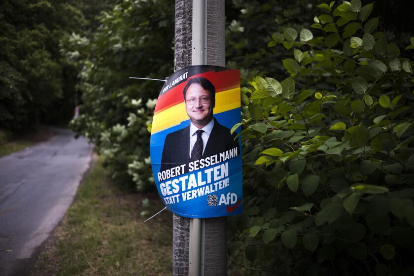 A election campaign poster of far-right AfD candidate Robert Sesselmann remains at a street at the outskirts of the small city Sonneberg at the German federal state Thuringia, Wednesday, July 5, 2023. The Alternative for Germany, or AfD, candidate Robert Sesselmann won the runoff election for a local county administrator in Sonneberg county on June 25, 2023. Sonneberg has a relatively small population of 56,800, but the win is a symbolic milestone for the far-right populist party AfD.(AP Photo/Markus Schreiber)