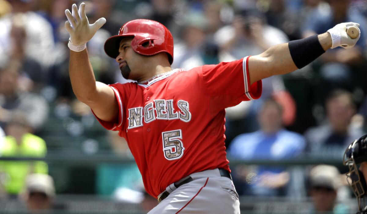 The Angels were shut out by the Mariners until first baseman Albert Pujols connected for a home run in the seventh inning Monday in Seattle.