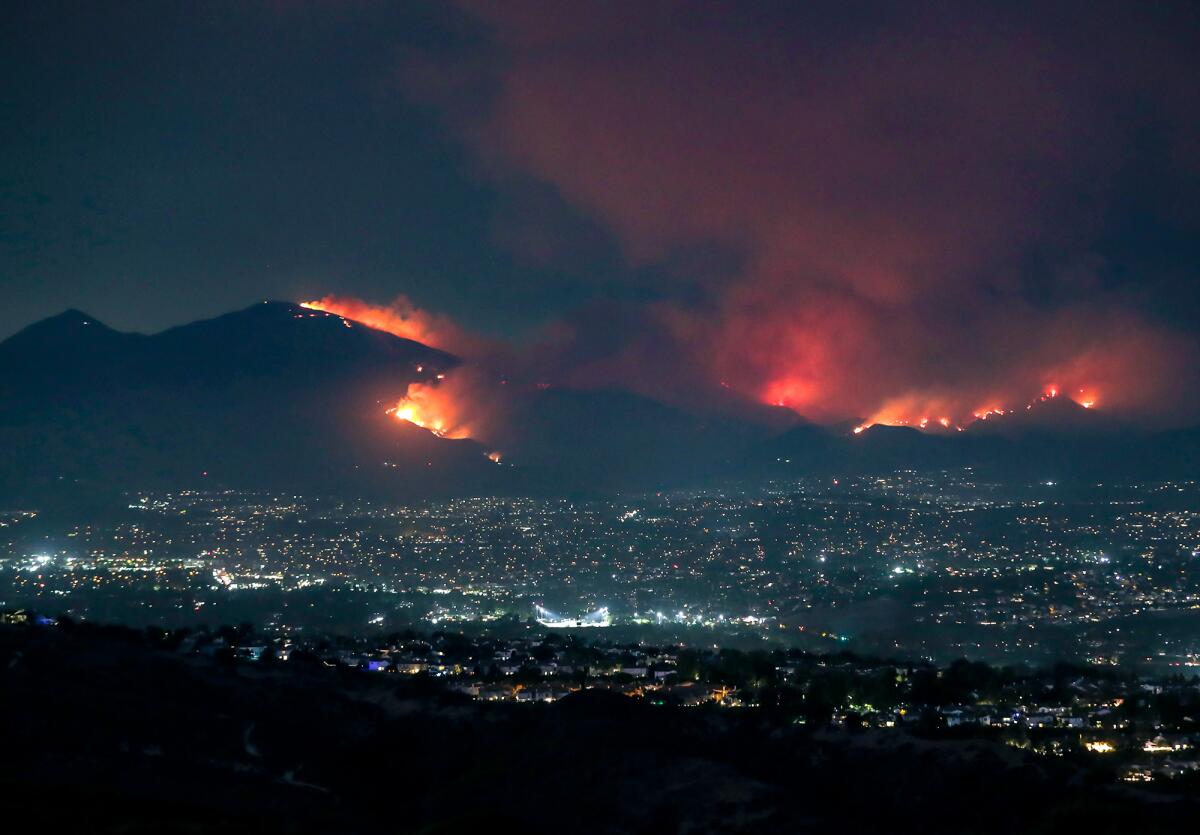 The Airport fire down Santiago Peak in Trabuco Canyon as seen from Alta Laguna Park in Laguna Beach on Monday.