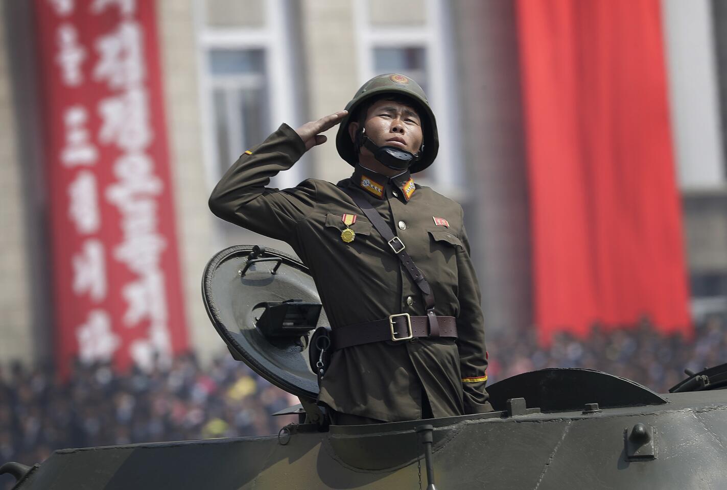 A soldier in a tank takes part in a military parade on Kim Il Sung Square in Pyongyang, North Korea, to celebrate the 105th anniversary of the birth of Kim Il Sung, the country's late founder and grandfather of current ruler Kim Jong Un.