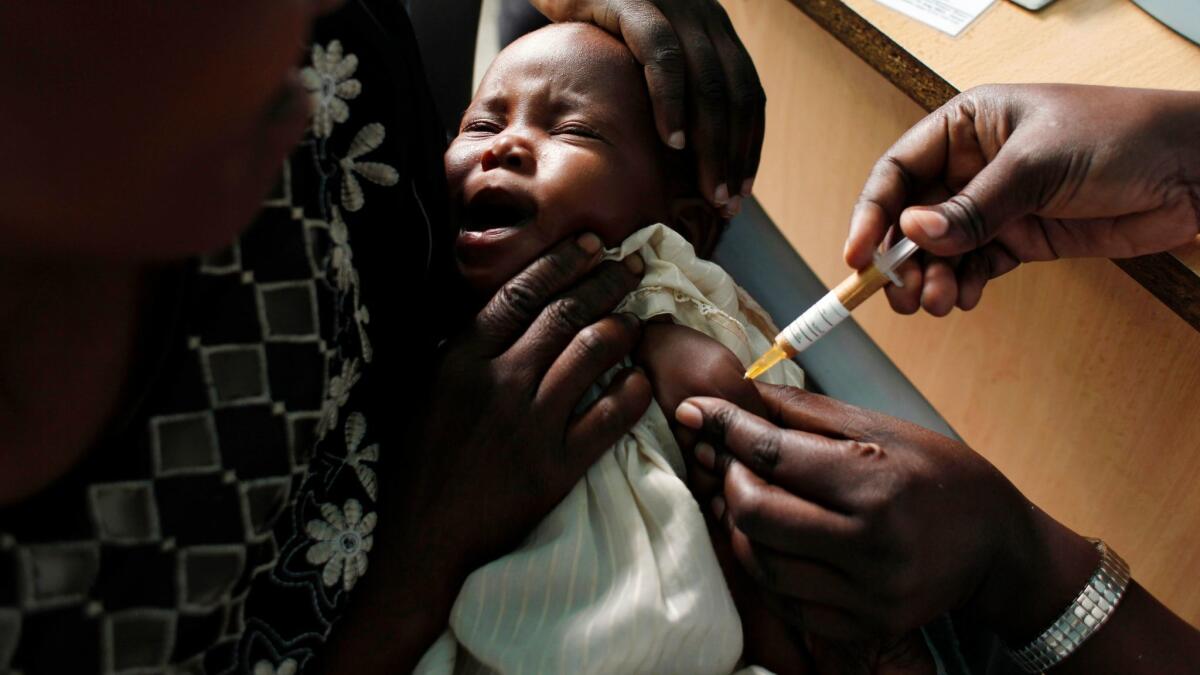 A baby in Kenya receives a malaria vaccine. (Karel Prinsloo / Associated Press)