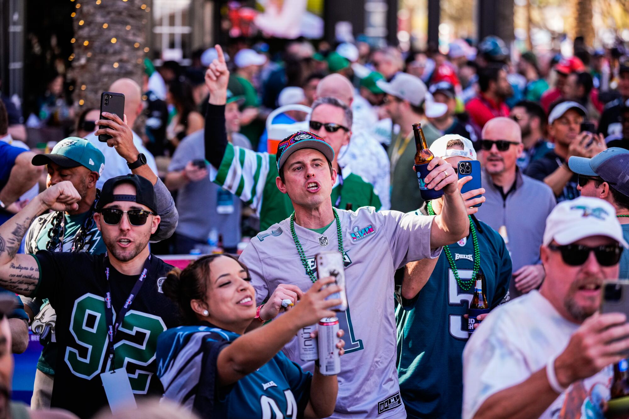 Eagles fans cheer outside McFadden's Restaurant and Saloon before the Super Bowl.