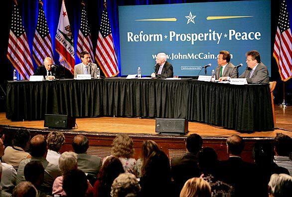 Sen. John McCain is flanked by figures in government, academia and land use issues during his energy round table in Santa Barbara.