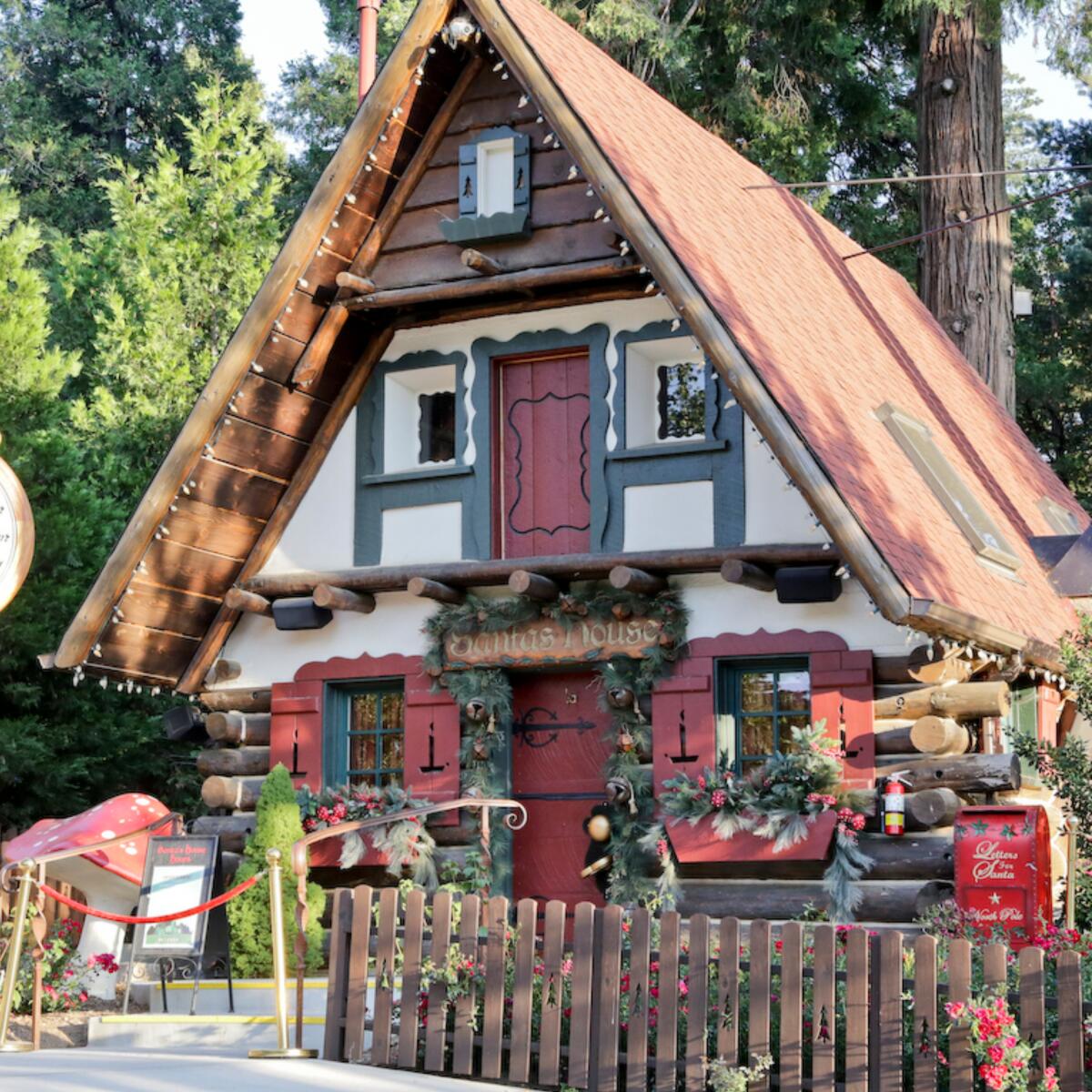 An alpine building with candy cane clock at SkyPark at Santa's Village in Lake Arrowhead.