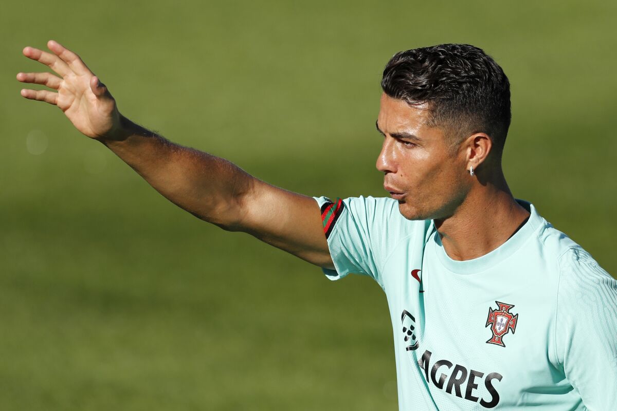 Portugal's Cristiano Ronaldo gestures during a training session in Oeiras, Portugal, Monday, Aug. 30, 2021. Portugal will play Ireland on Wednesday in a Qatar 2022 World Cup qualifying match. (AP Photo/Armando Franca)