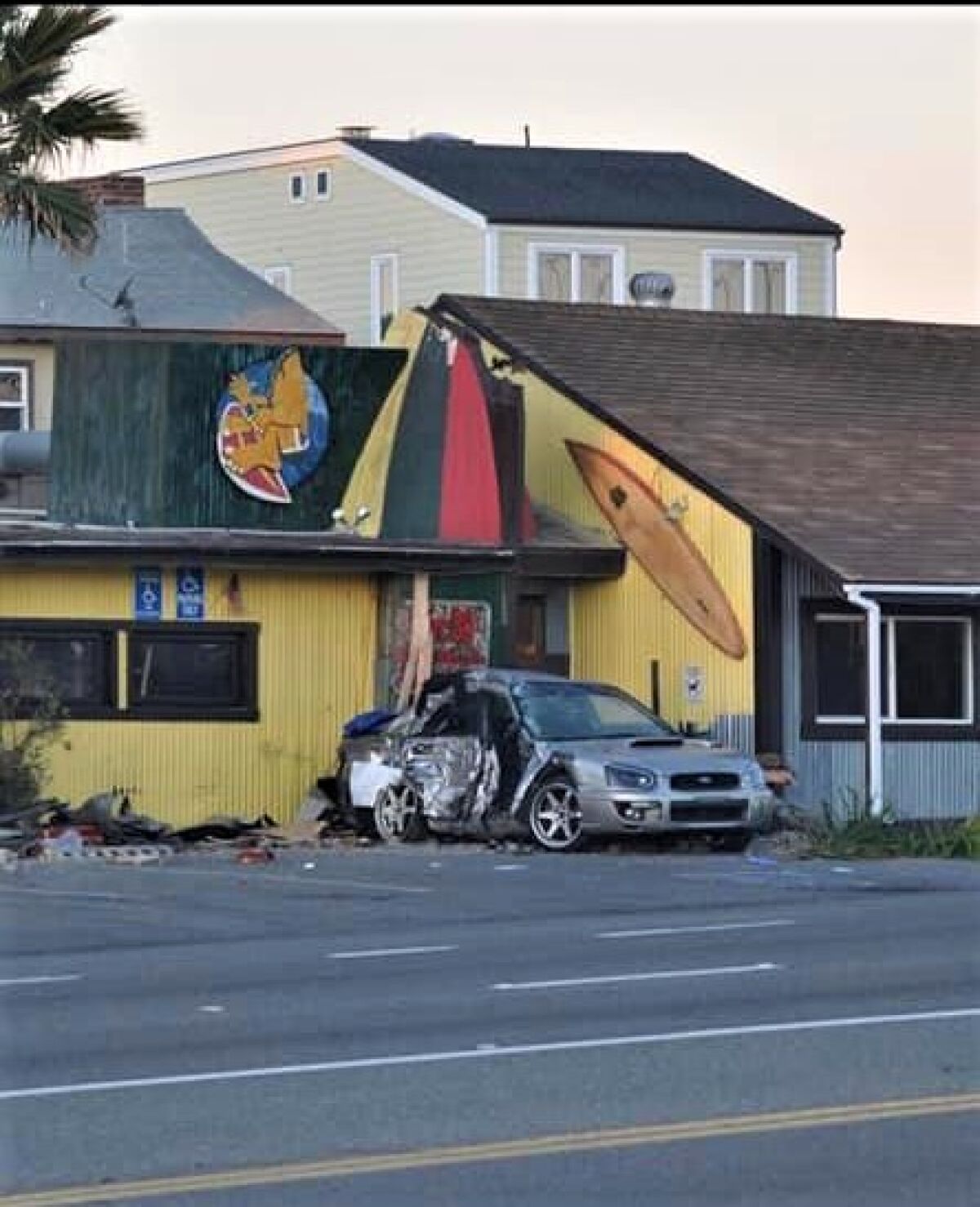 A photo taken Feb. 6, 2022 shows a vehicle that crashed into a Taco Surf restaurant on PCH in Surfside.