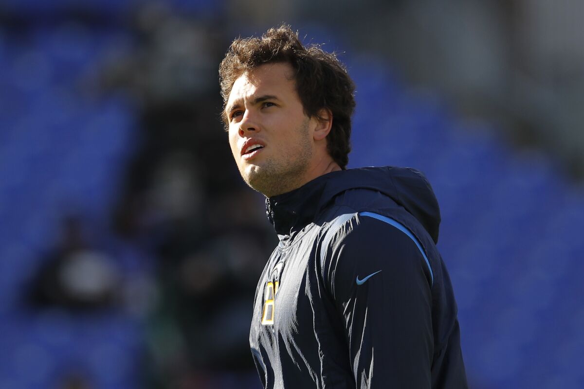 Chargers tight end Hunter Henry pauses on the field before a playoff game against the Baltimore Ravens on Jan. 6, 2019 in Baltimore.