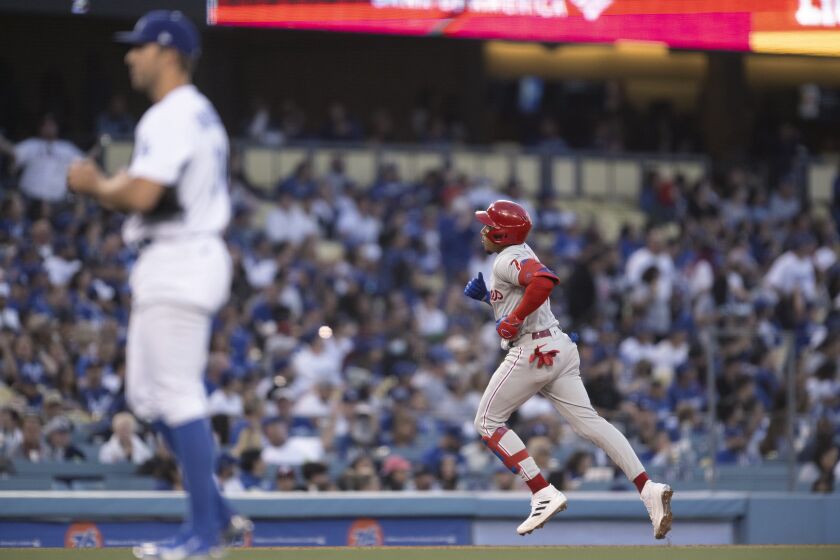 Philadelphia Phillies' Johan Camargo runs the bases after hitting a two-run home run against the Los Angeles Dodgers during the second inning of a baseball game in Los Angeles, Thursday, May 12, 2022. (AP Photo/Kyusung Gong)