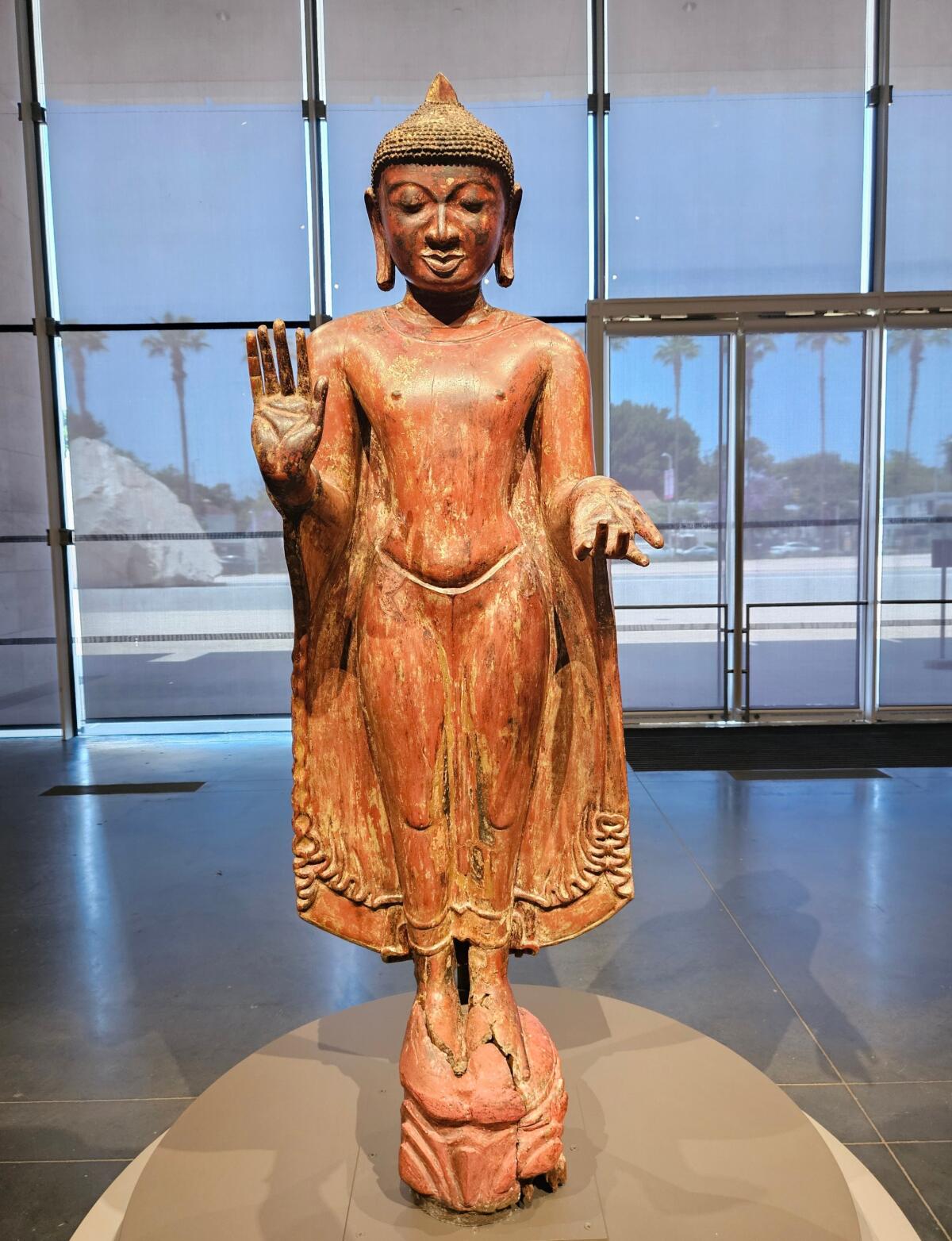 A Buddha figure made from lacquered wood.