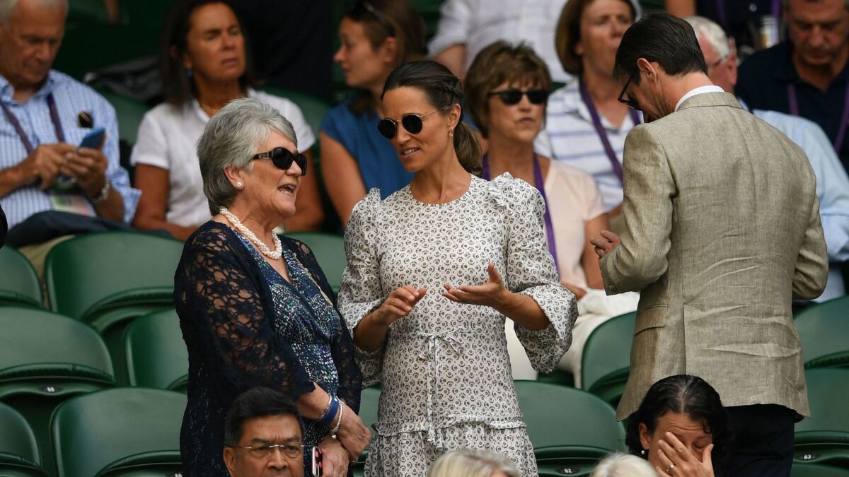 Pippa Middleton mingles in the royal box in Centre Court at Wimbledon on Friday.