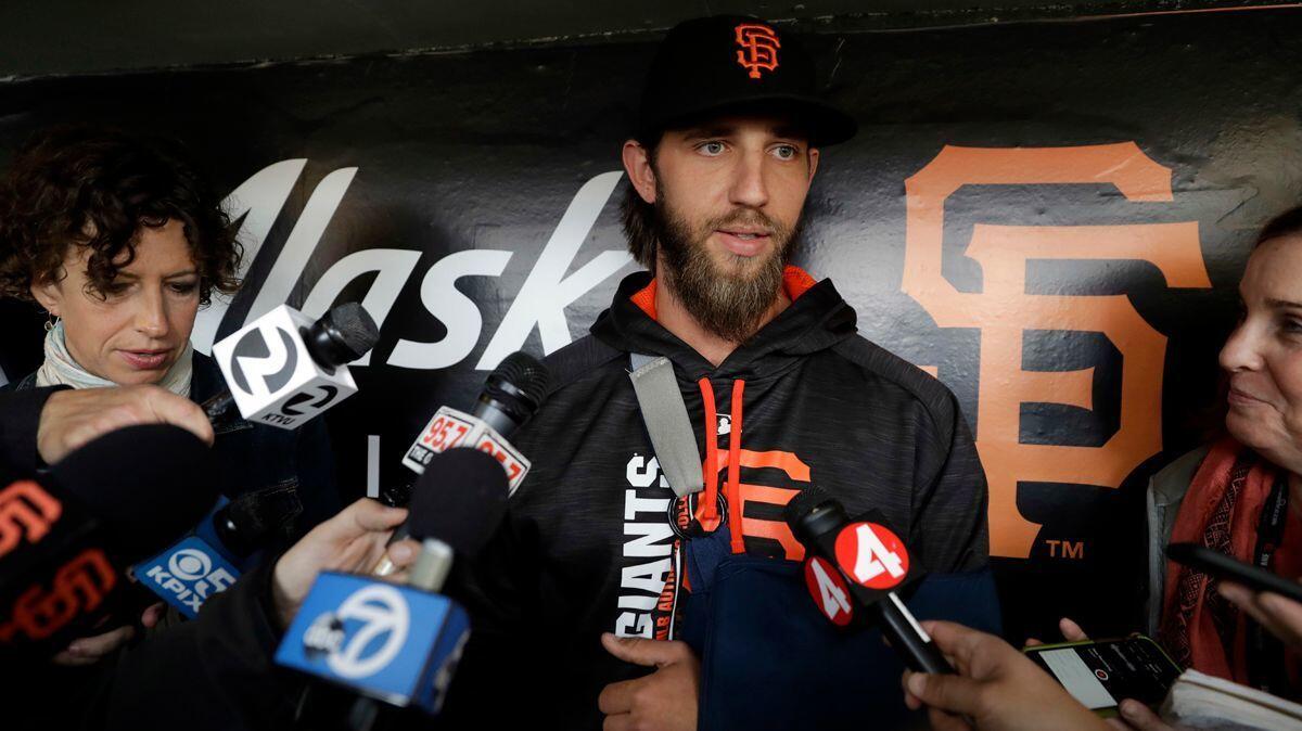 San Francisco Giants pitcher Madison Bumgarner answers questions about his shoulder injury before an April 24 game against the Dodgers at AT&T Park.