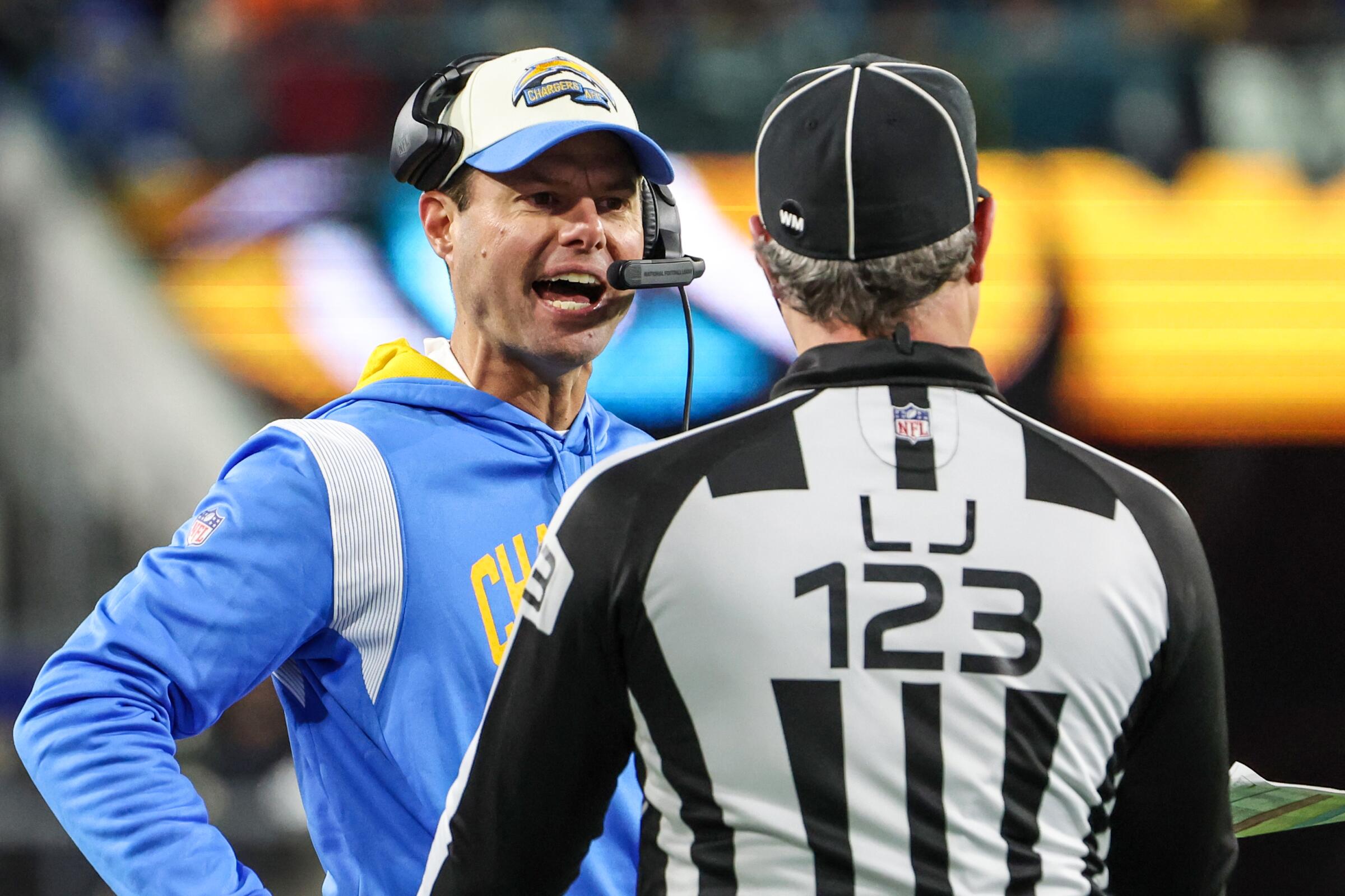 Chargers coach Brandon Staley argues with line judge Mike Dolce during the team's playoff loss to the Jaguars.